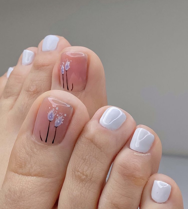 Pale blue flower toe nail designs